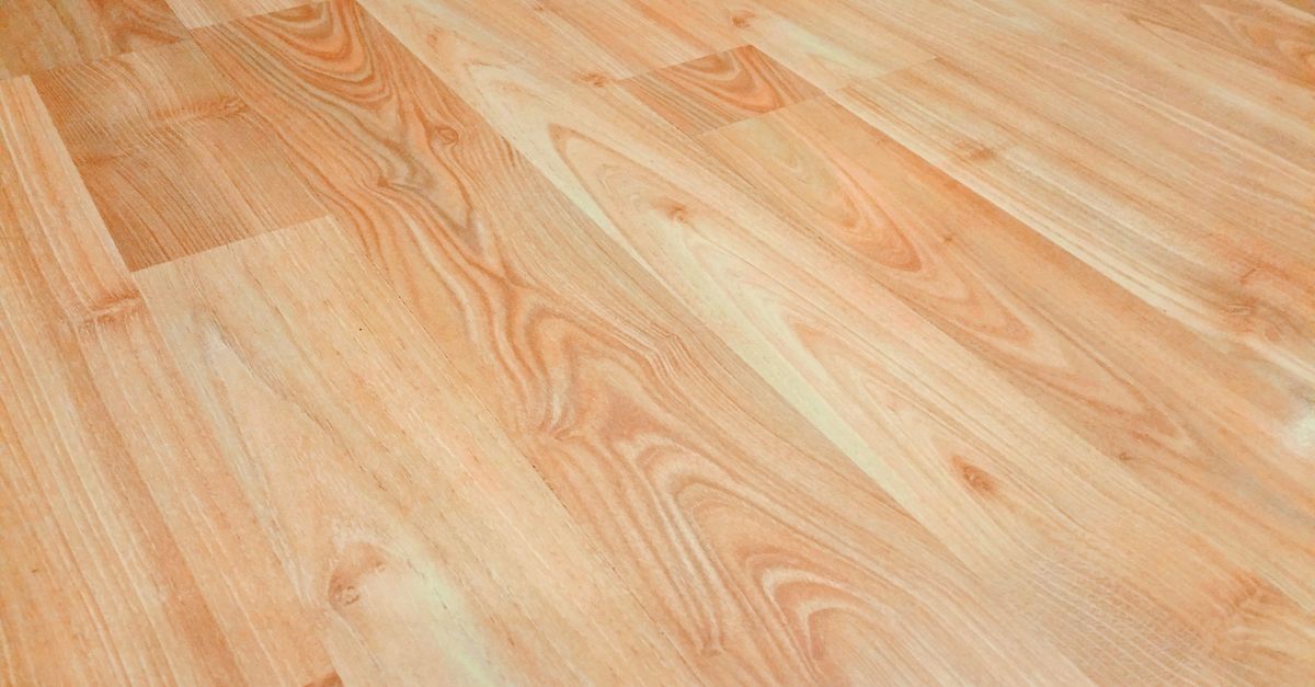 Durable hospital-grade vinyl flooring with professional installation in a healthcare facility hallway