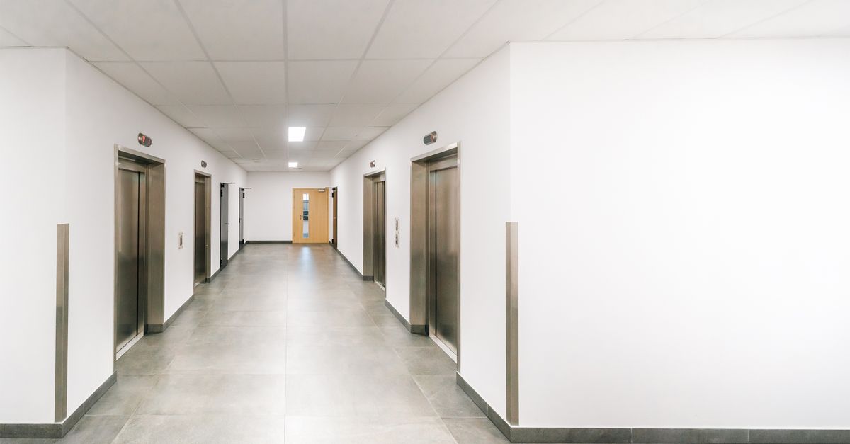 Clean modern hospital corridor with vinyl flooring installation