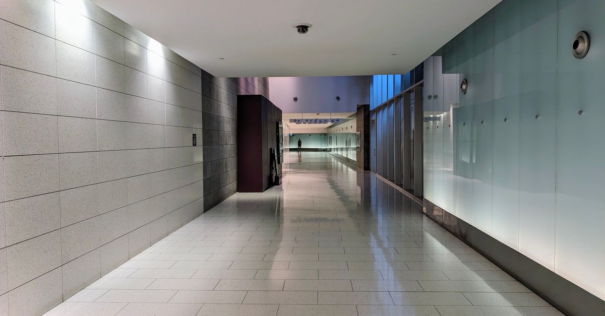 Professional hallway with polished commercial tile flooring
