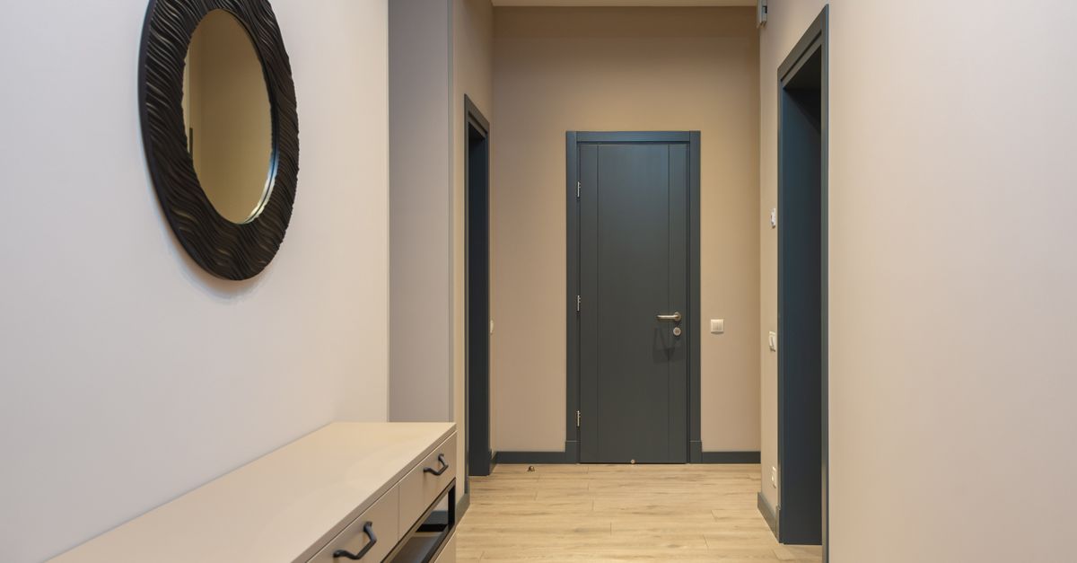 Modern apartment hallway with luxury vinyl flooring installed, clean contemporary design